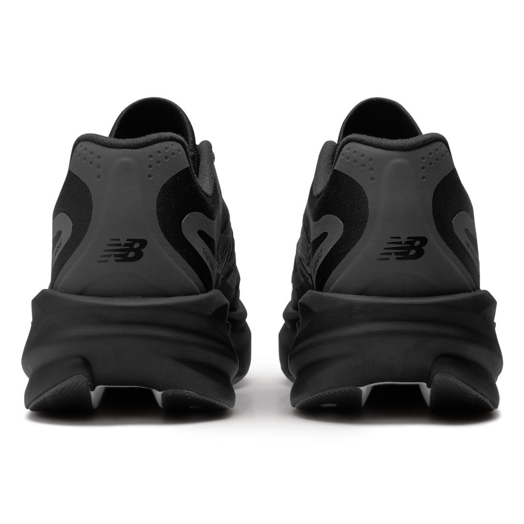 New Balance SuperComp Rebel men’s in Black and Magnet, pair viewed from behind 